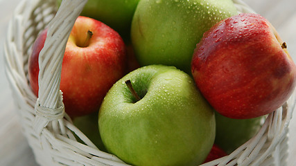 Image showing Red and green apples in basket 