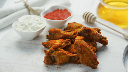 Image showing Fried chicken wings in served