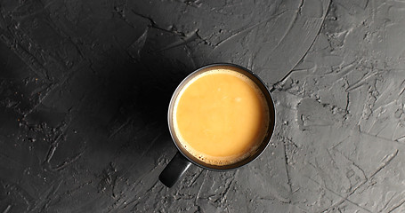 Image showing Brown mug with coffee and milk