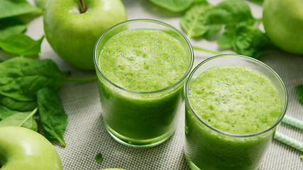 Image showing Cups with green smoothie on table