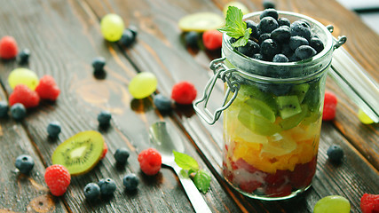 Image showing Assortment of fruits in jar 