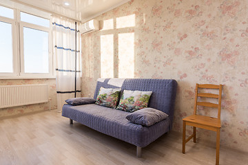 Image showing Sofa and chair at the wall in the room