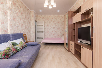 Image showing Interior of the hotel room, bed, sofa, wardrobes, TV