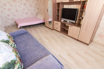 Image showing The floor is covered with laminated panels in the interior of the living room