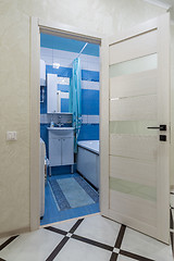 Image showing The open door to the bathroom in the interior of the apartment