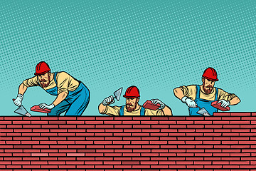 Image showing construction team laying a brick wall background