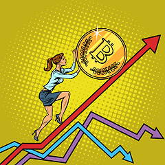 Image showing woman businesswoman roll a bitcoin coin up