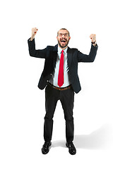 Image showing Winning success man happy ecstatic celebrating being a winner. Dynamic energetic image of male model