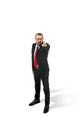 Image showing Full body portrait of happy businessman pointing to camera on white