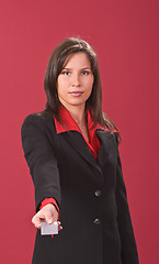 Image showing Businesswoman offering a credit card