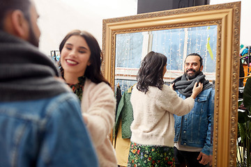 Image showing couple choosing clothes at vintage clothing store