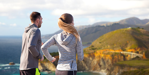 Image showing happy couple running outdoors