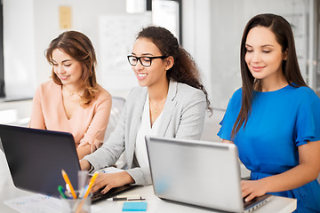 Image showing businesswomen with laptop working at office