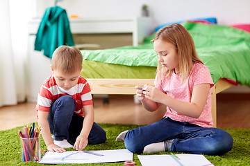 Image showing happy creative kids making crafts at home