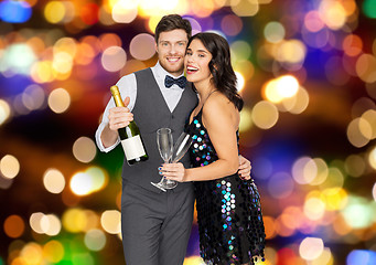 Image showing happy couple with champagne and glasses at party