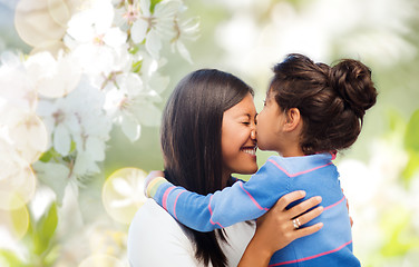 Image showing happy mother and daughter hugging and kissing