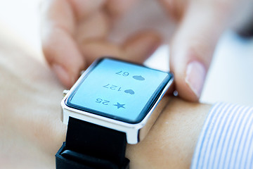 Image showing close up of smart watch with social media icons