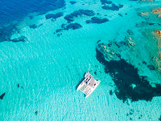 Image showing Drone aerial view of catamaran sailing boat in Maddalena Archipelago, Sardinia, Italy.