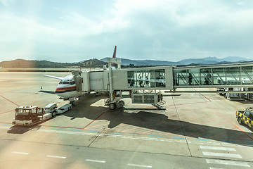 Image showing Airplane Boarding on the airport before departure.