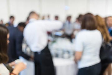 Image showing Blured image of businesspeople at coffee break at conference meeting.