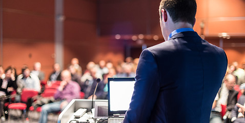 Image showing Public speaker giving talk at business event.