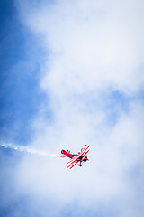 Image showing Veteran propeller airplane flying on a blue sky