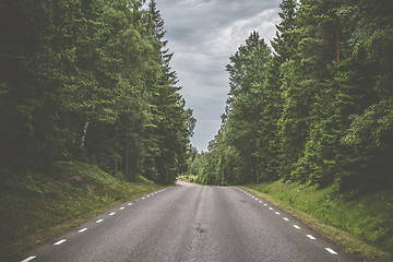 Image showing Road with white stripes made of asphalt