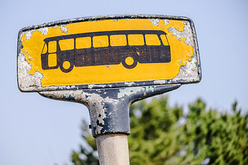 Image showing Yellow bus stop sign with a rough look