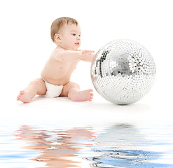 Image showing adorable baby boy with big disco ball