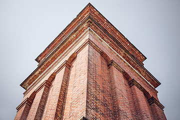 Image showing High tower with red bricks from below