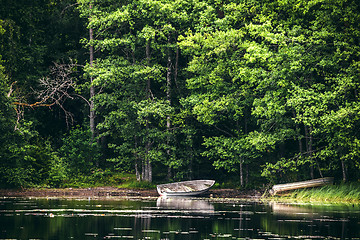 Image showing Wooden boat on the shore of a lake