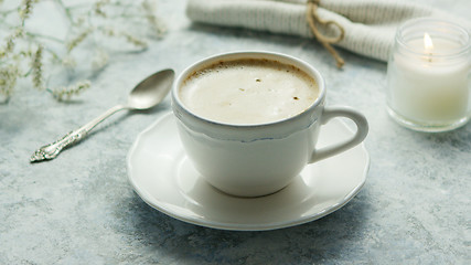 Image showing Cup of coffee and candle