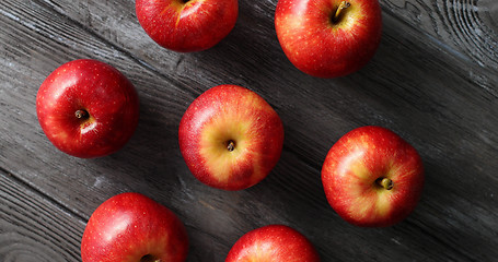 Image showing Red ripe apples on wooden table