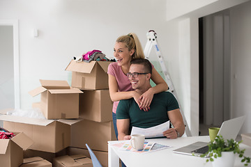 Image showing Young couple moving in a new home