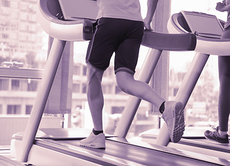 Image showing sportsman exercise jogging on treadmill