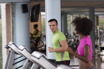 Image showing people exercisinng a cardio on treadmill