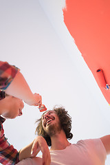 Image showing couple painting interior wall