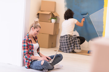 Image showing Happy couple doing home renovations