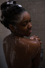 Image showing African American woman in the shower