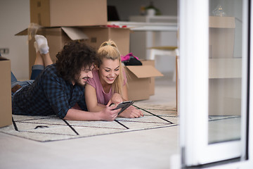 Image showing Young couple moving in a new flat