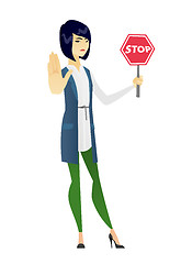 Image showing Asian business woman holding stop road sign.