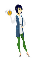 Image showing Asian business woman holding alarm clock.