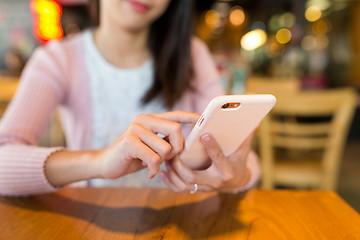 Image showing Woman use of mobile phone in cafe