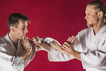 Image showing Two men fighting at Aikido training in martial arts school