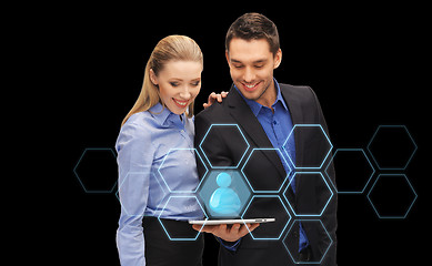 Image showing businesspeople with tablet pc and network hologram