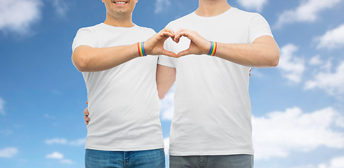 Image showing couple with gay pride rainbow wristbands and heart