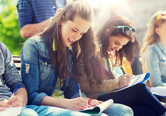 Image showing group of students with notebooks at school yard