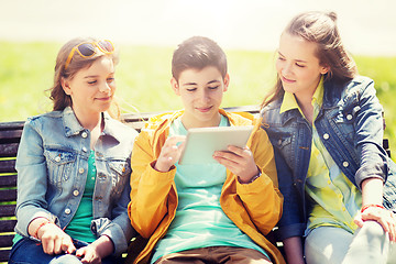 Image showing happy friends with tablet pc computer outdoors