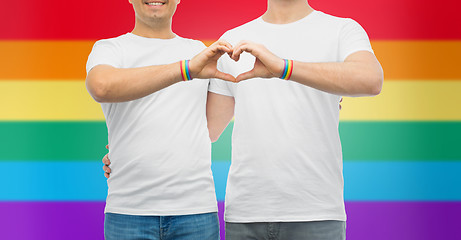 Image showing couple with gay pride rainbow wristbands and heart