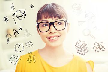 Image showing happy asian young woman in glasses at home